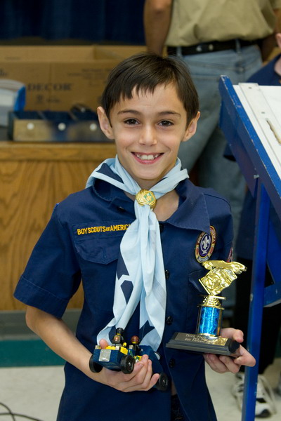 Picture of Nicholas with his Pinewood Derby car