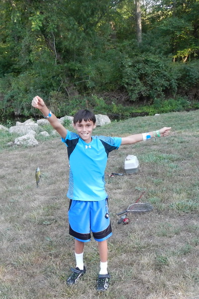 Nicholas holding up a recent catch