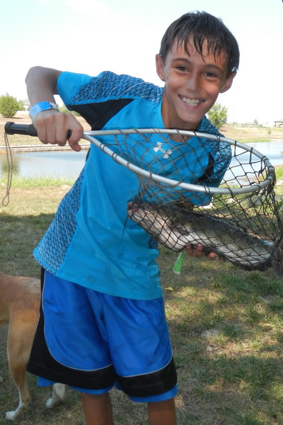 Nicholas with a large mouth bass