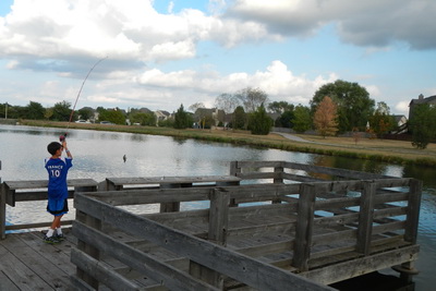 NIcholas fishing from a dock